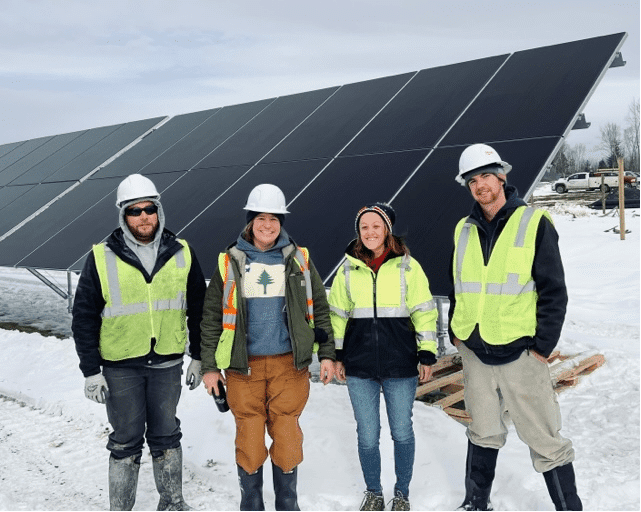 Tradesmen and Tradeswomen Standing In Front of a Solar Site