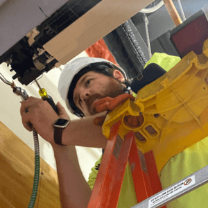 Electrical Skilled Tradesman Working On Site