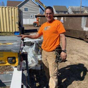 Professional carpenter working on commercial construction project